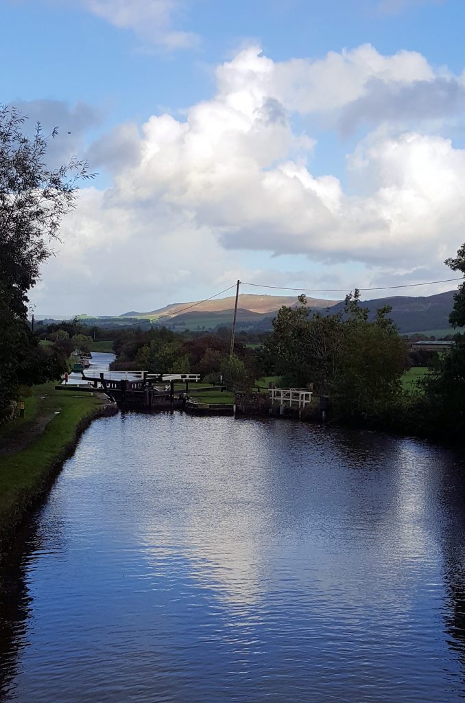 View of the Dales as Lady Teal starts up Bank Newton Locks on the Leeds Liverpool canal